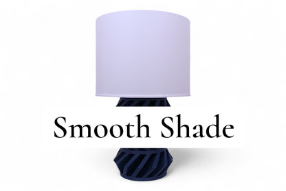 Table lamp – white cylindrical lampshade with dark geometric base, diagonal cutouts, labeled “Smooth Shade”
