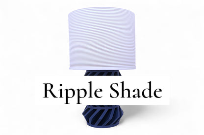 Table lamp – white ripple-textured lampshade with dark angular base, labeled “Ripple Shade”