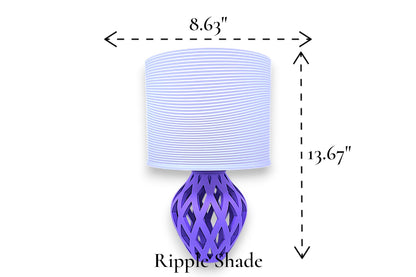 Table lamp – white ripple-textured cylindrical lampshade with sculptural purple lattice-style base, 8.63" diameter × 13.67" height, labeled “Ripple Shade”
