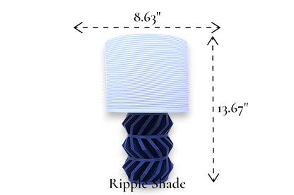 Table lamp – white ripple-textured lampshade with geometric dark blue base, 8.63" diameter × 13.67" height, labeled “Ripple Shade”
