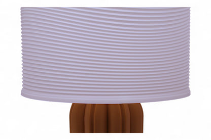 Table lamp – white ripple-textured lampshade with sculptural orange-brown petal-like base, labeled “Ripple Shade”
