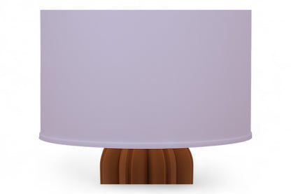 Table lamp – white cylindrical lampshade with sculptural wood-tone base, rounded tubular segments forming stable support
