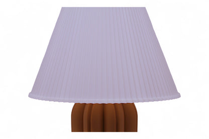 Lamp with a pleated purple shade on a white background