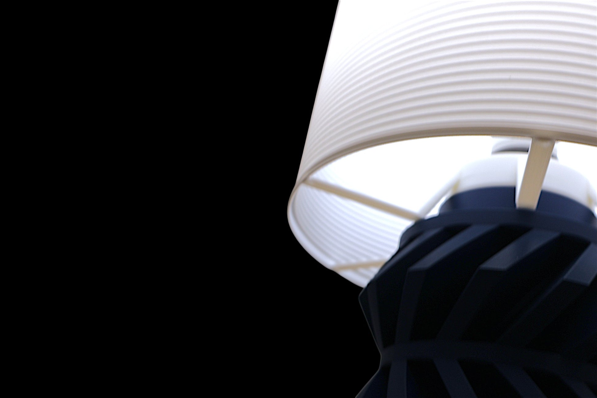 Lamp base component – dark blue helical gear with white stabilizer ring and angled struts, shown close-up
