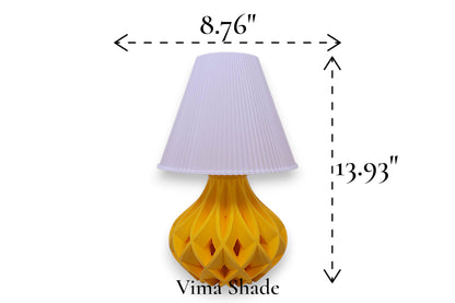 Table lamp – white pleated conical lampshade with sculptural yellow lattice-style base, 8.76" diameter × 13.93" height, labeled “Vima Shade”
