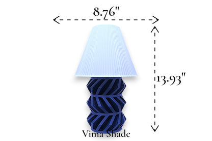 Table lamp – white pleated conical lampshade with geometric dark base, 8.76" diameter × 13.93" height, labeled “Vima Shade”