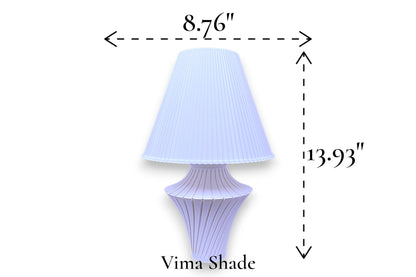 Table lamp – white pleated conical lampshade with sculptural purple fluted base, 8.76" diameter × 13.93" height, labeled “Vima Shade”
