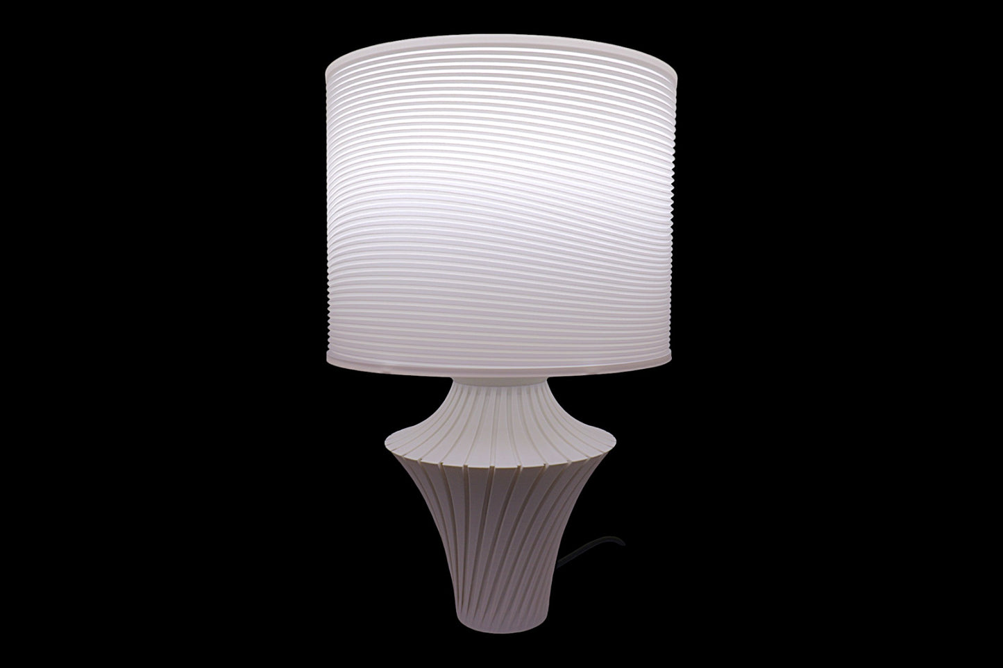 White textured table lamp on a black background