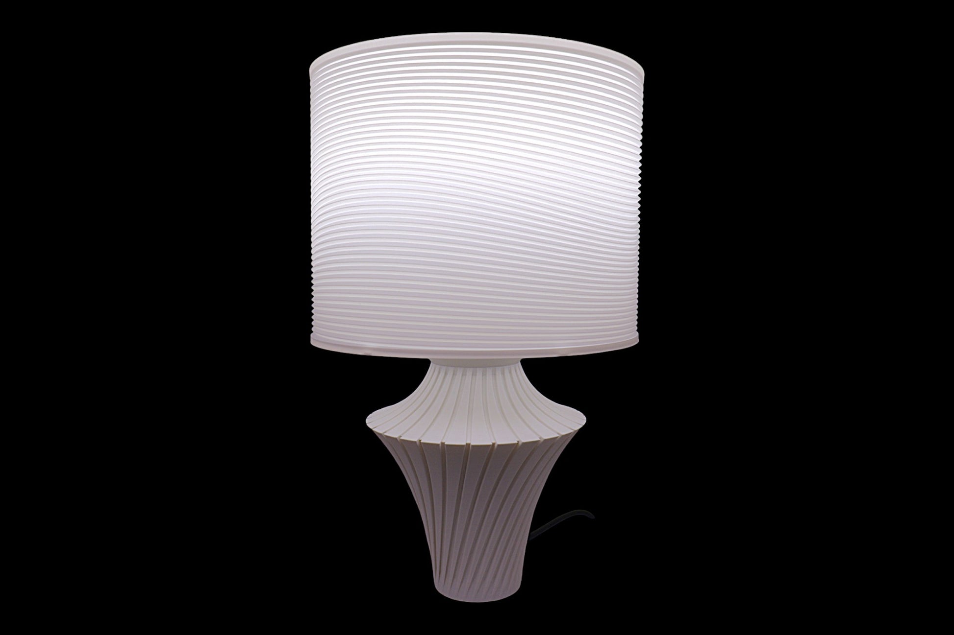 White textured table lamp on a black background