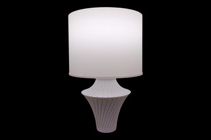 White table lamp with a textured base on a black background