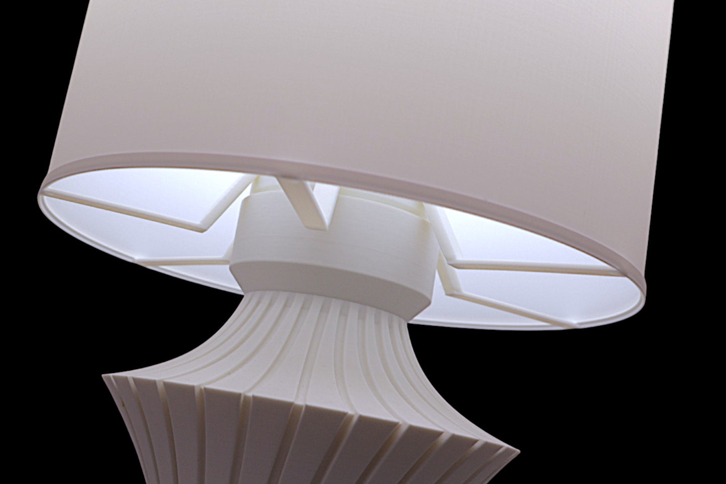 White lamp with a unique design on a black background