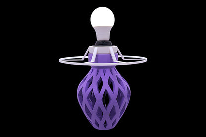 Purple geometric light fixture with a white light bulb on a black background