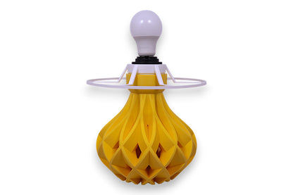 Yellow decorative lamp with a white bulb on a white background