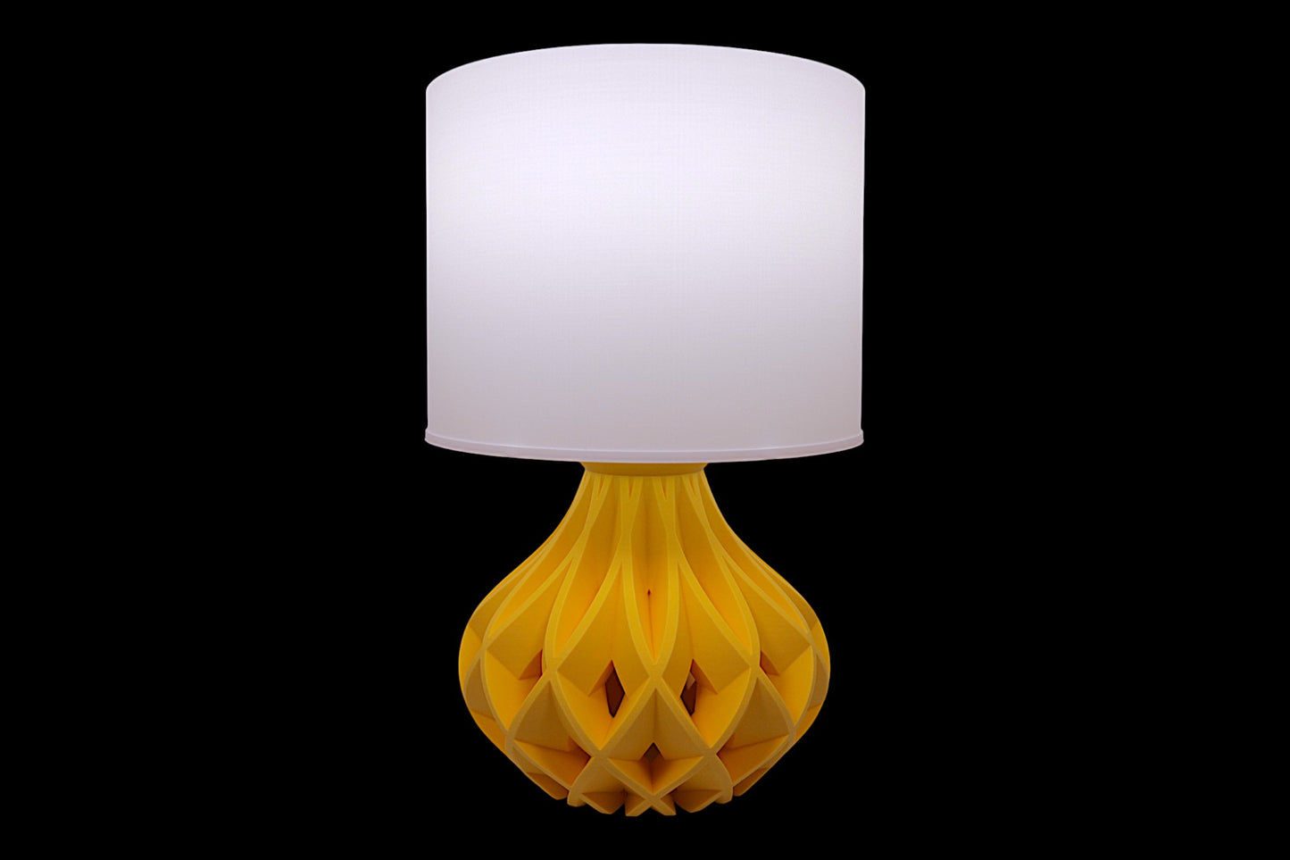 Table lamp – white cylindrical lampshade with sculptural yellow faceted base, labeled “Smooth Shade”
