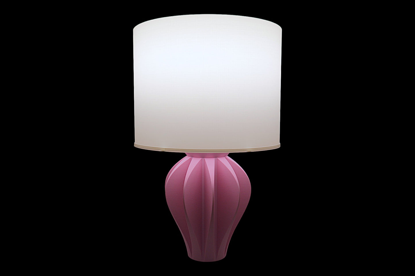 Pink table lamp with a white shade on a black background