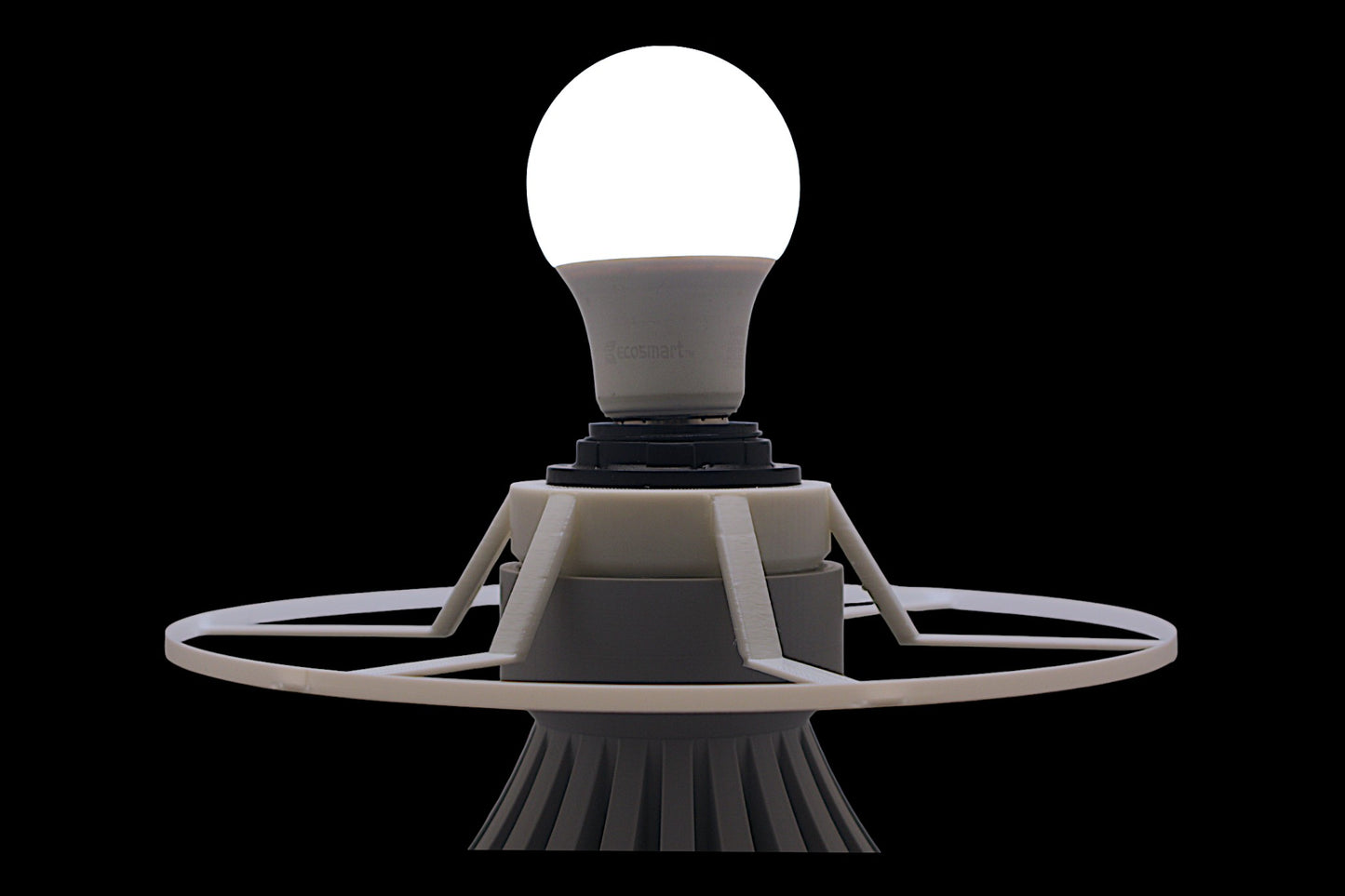 Light bulb on a futuristic base against a black background