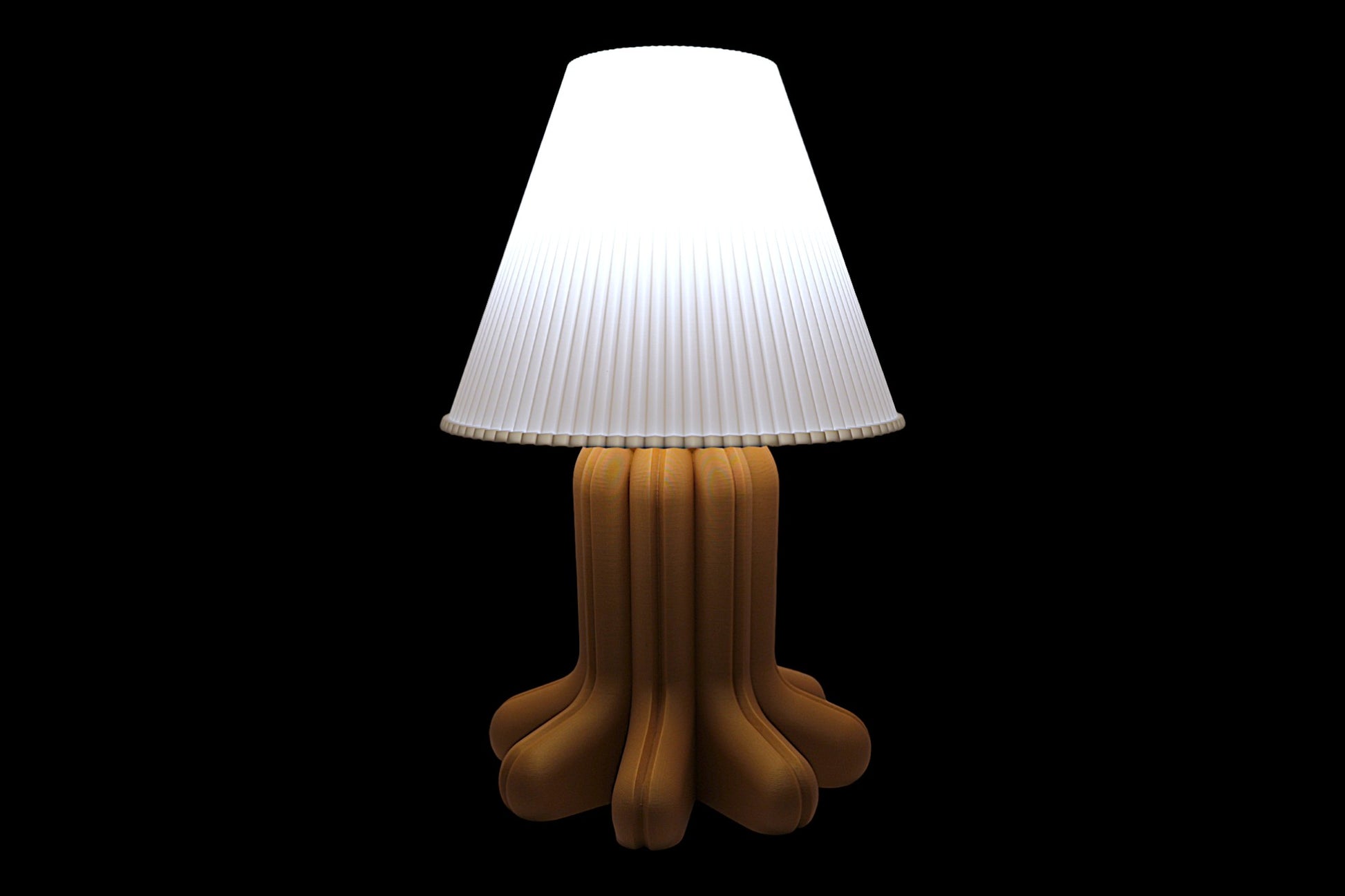 Lamp with a white shade and brown base on a black background