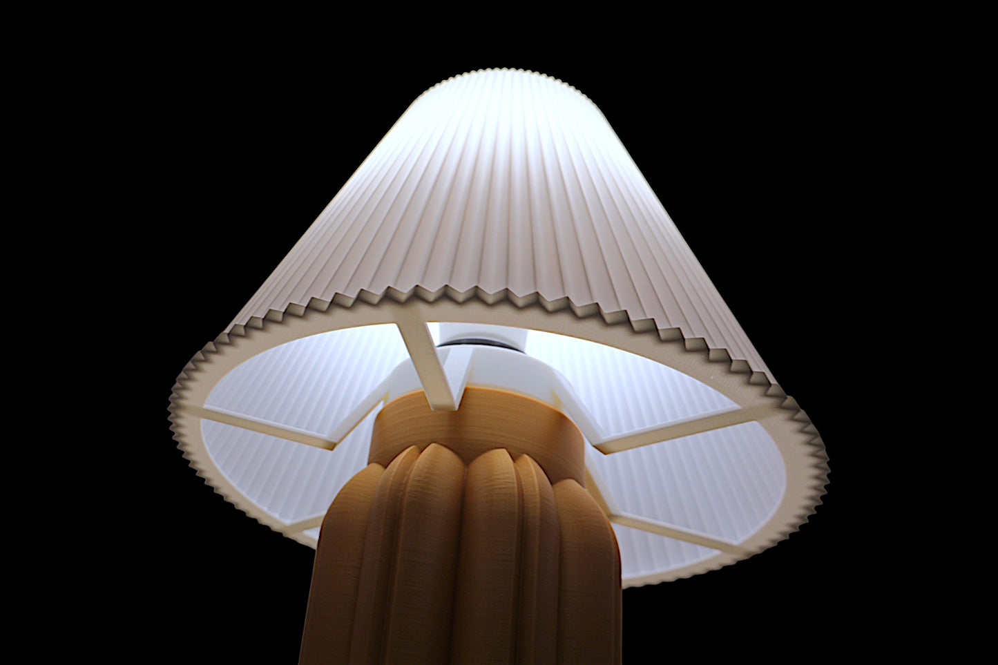 Close-up of a light bulb with a textured white shade against a black background