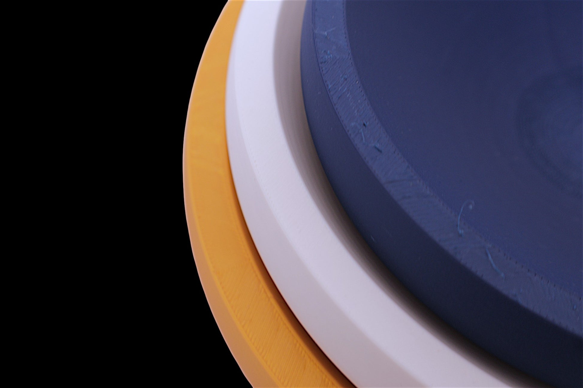 Catch-all trays – 3-pack set in orange, white, and navy blue PLA, nested round shape with curved surfaces
