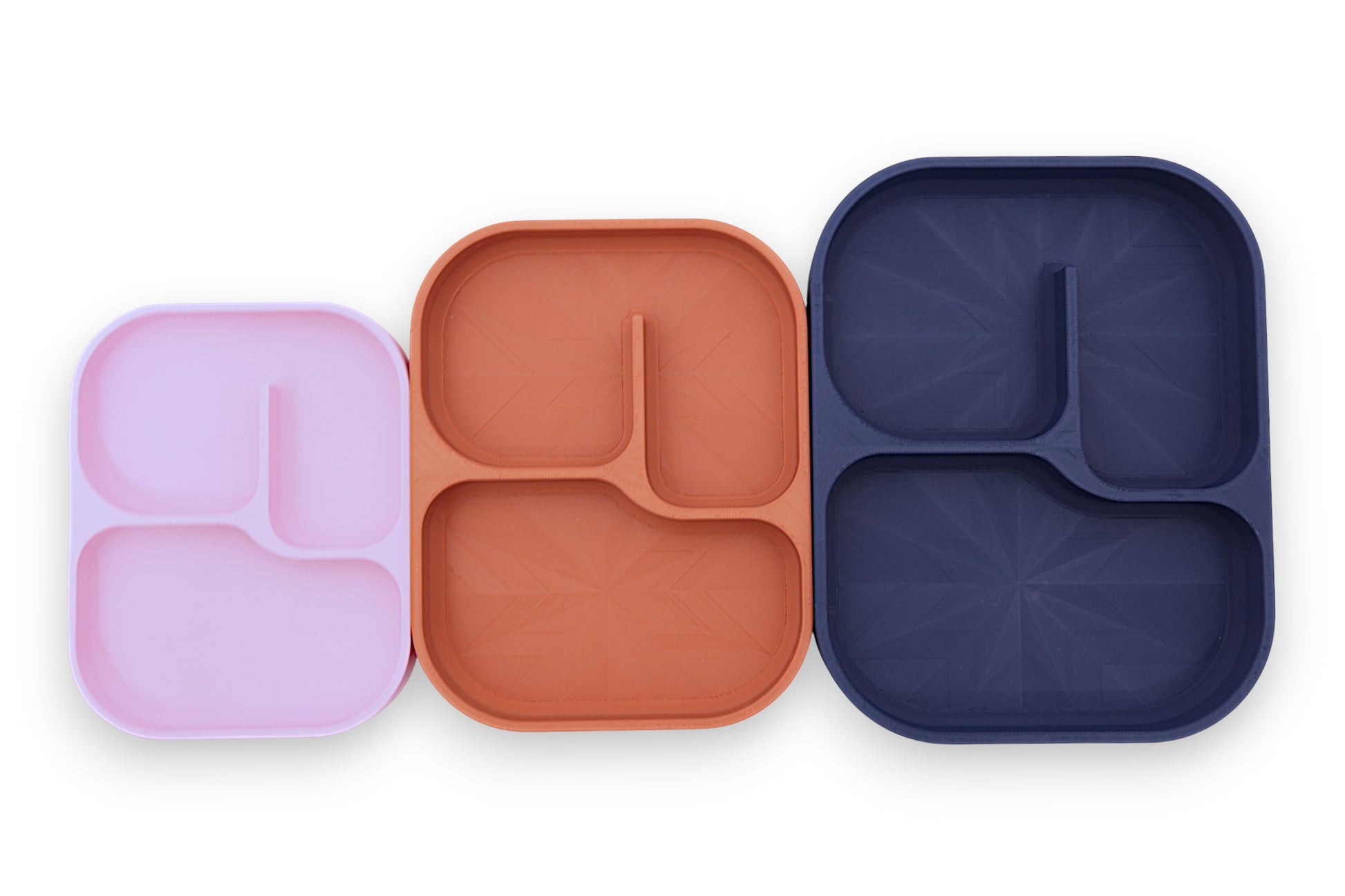 Divided plates – 3-pack set in pink, terracotta, and dark blue, stacked with rounded corners and raised edges