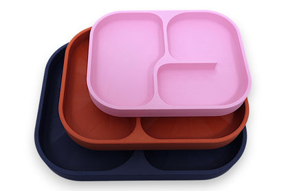 Divided plates – 3-pack set in pink, terracotta, and dark blue silicone, stacked with rounded corners and raised edges