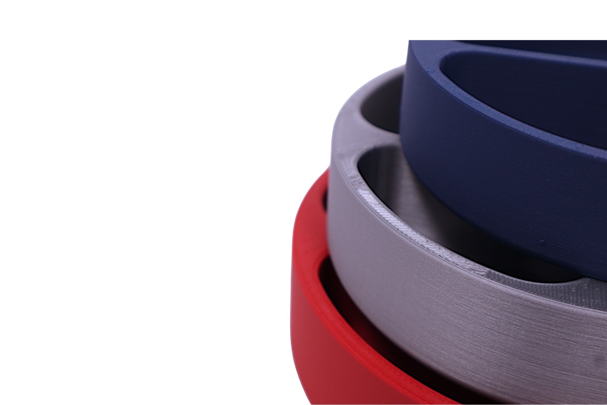 Stack of red, gray, and blue circular objects on a white background