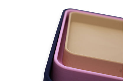 Catch-all trays – 3-pack set in dark blue, pink, and beige PLA, nested with rounded corners and smooth surfaces
