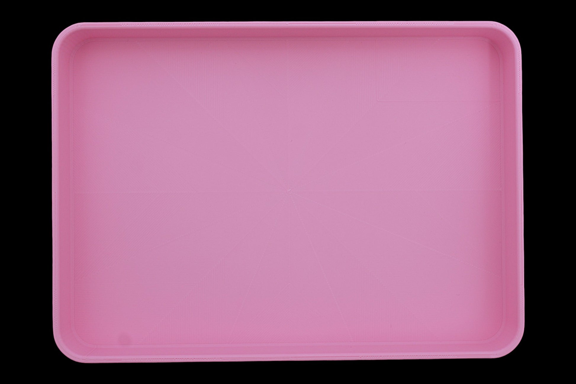 Catch-all tray – 3D printed in pink PLA with rectangular shape and subtle radial base pattern, shown empty

