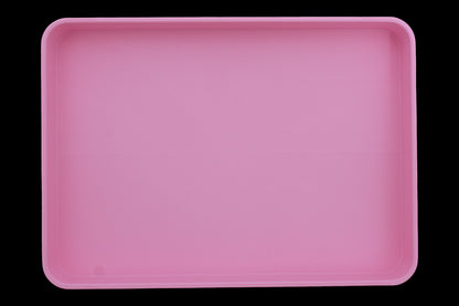 Catch-all tray – 3D printed in pink PLA with rectangular shape and subtle radial base pattern, shown empty
