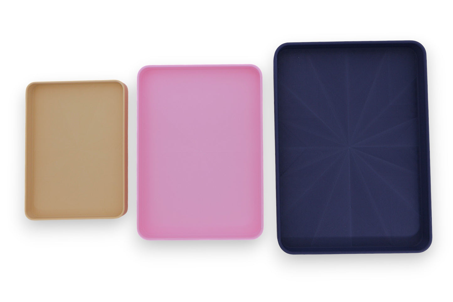 Catch-all trays – 3-pack set in beige, pink, and dark blue PLA, arranged side by side for size and color comparison

