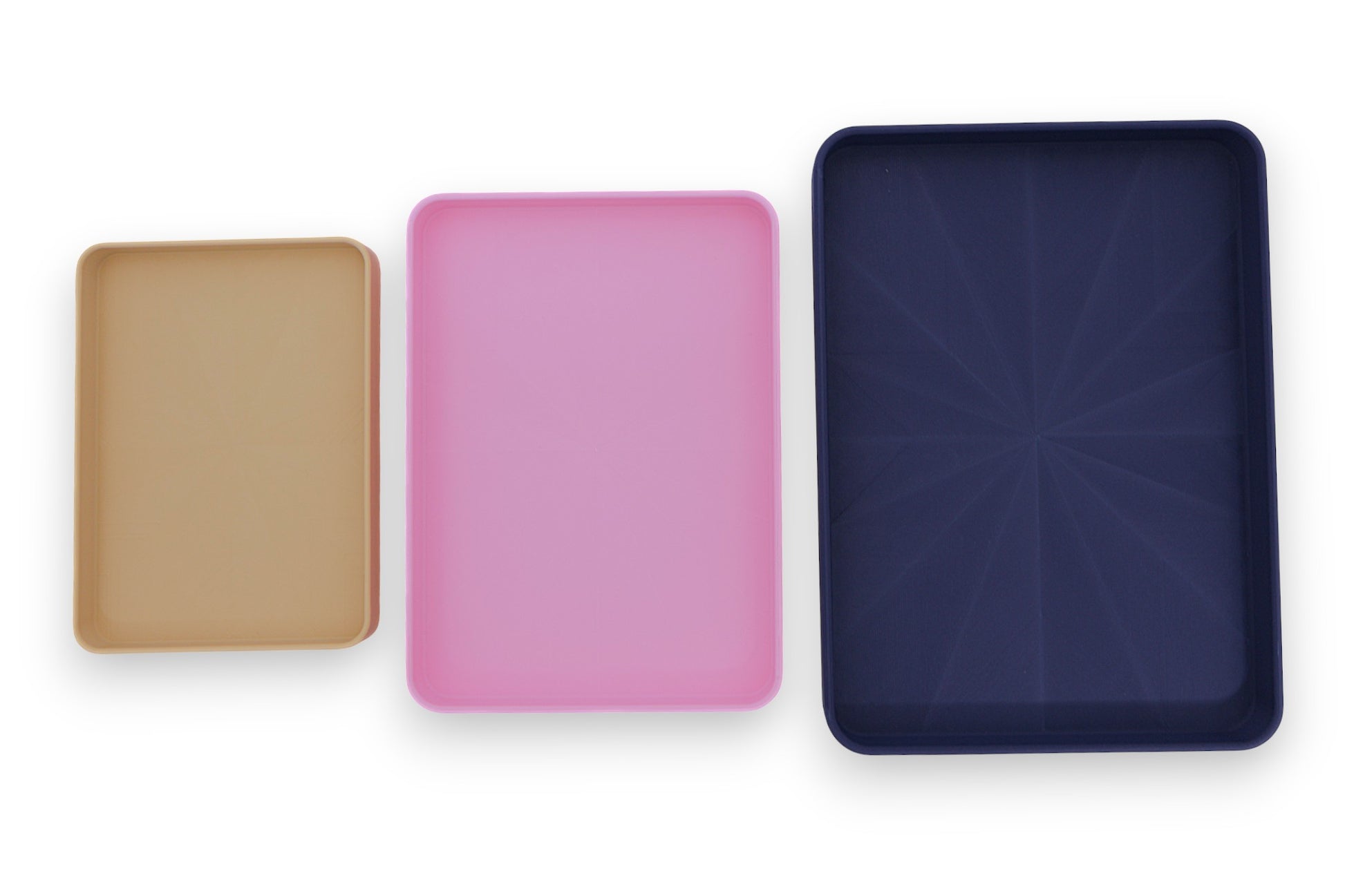 Catch-all trays – 3-pack set in beige, pink, and dark blue PLA, arranged side by side for size and color comparison

