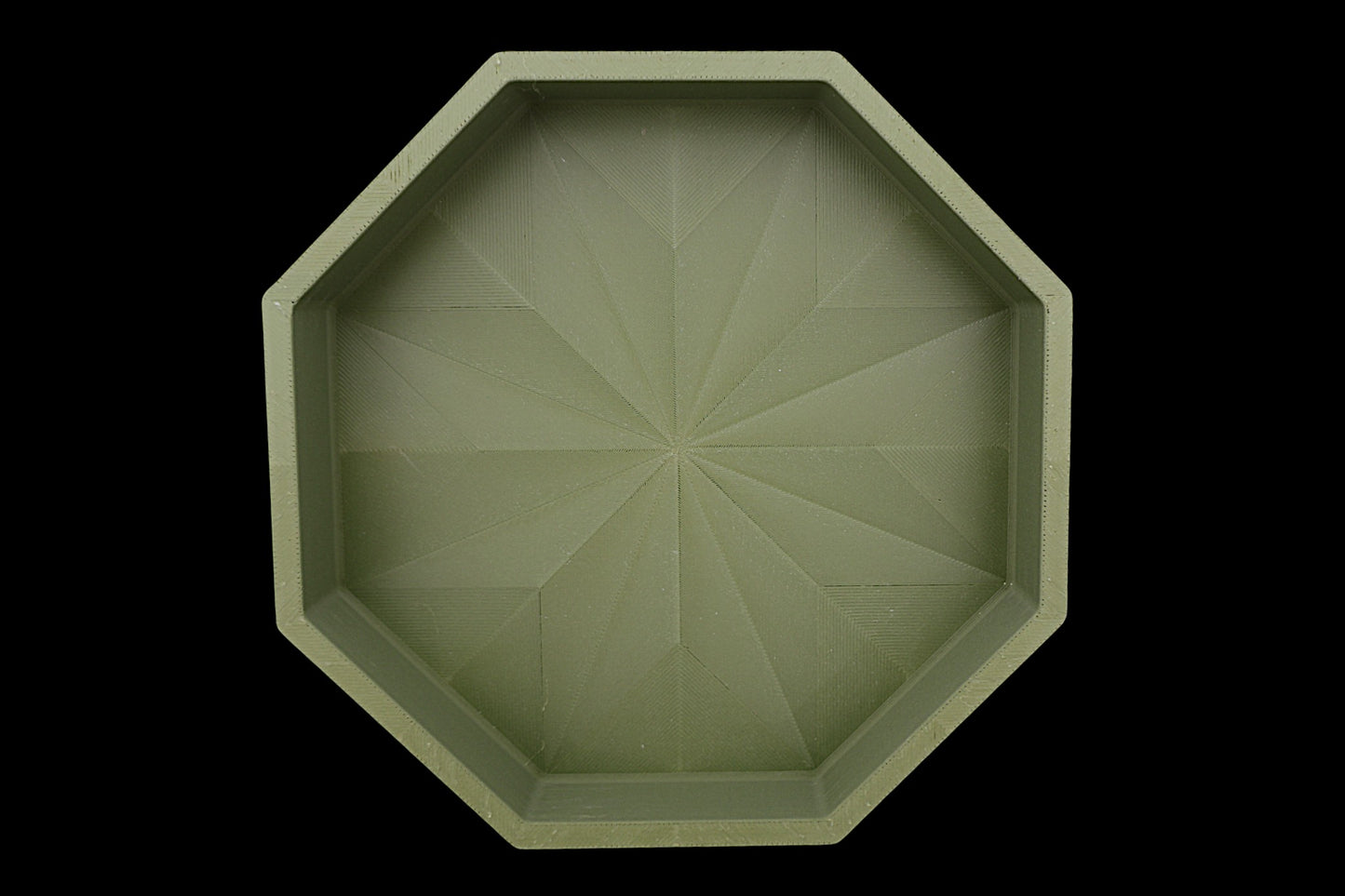 Catch-all tray – 3D printed in green PLA with octagonal shape and starburst base pattern, shown empty
