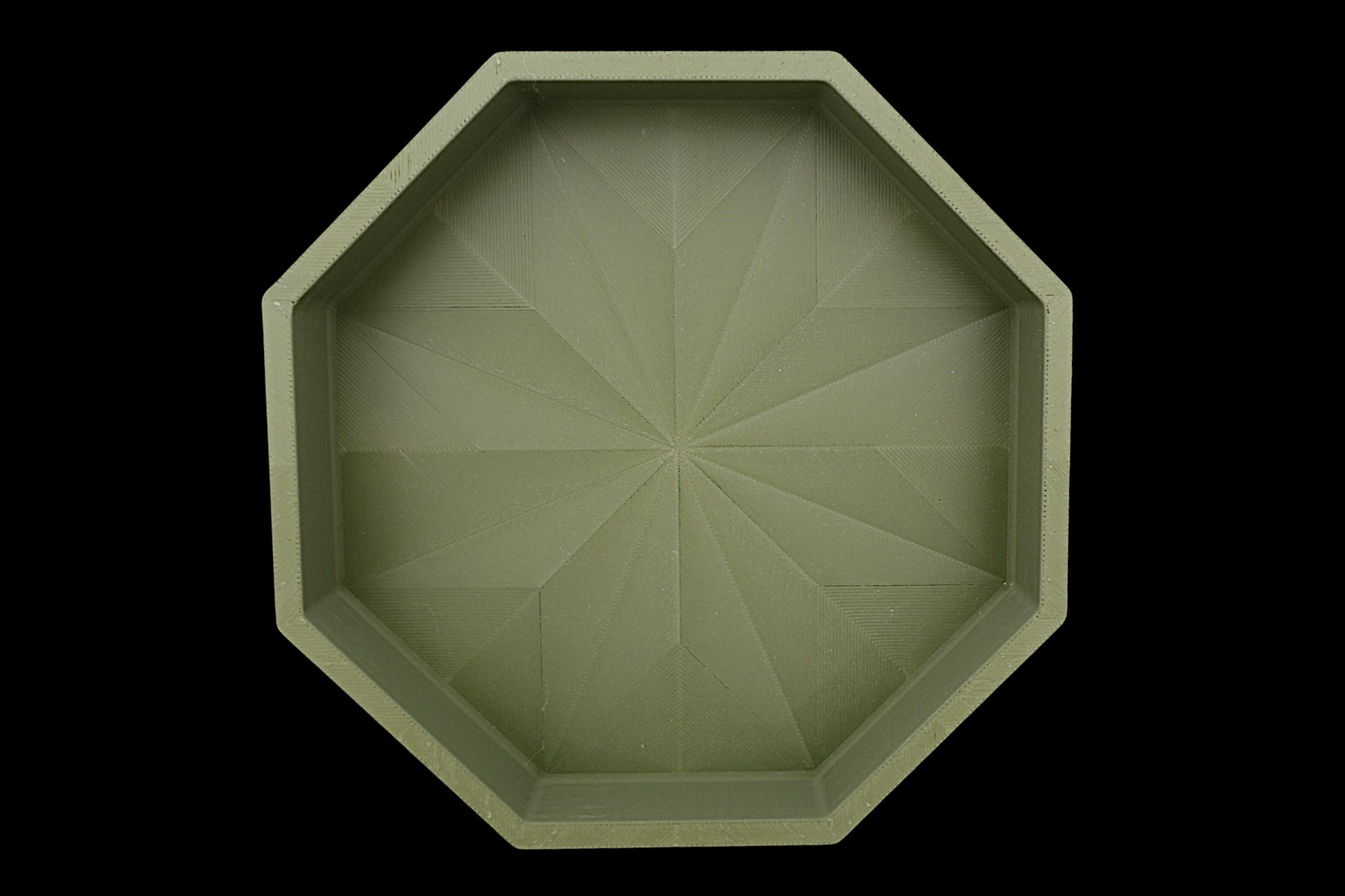 Catch-all tray – 3D printed in green PLA with octagonal shape and starburst base pattern, shown empty
