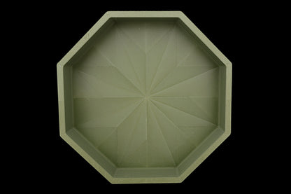 Catch-all tray – 3D printed in green PLA with octagonal shape and starburst base pattern, shown empty
