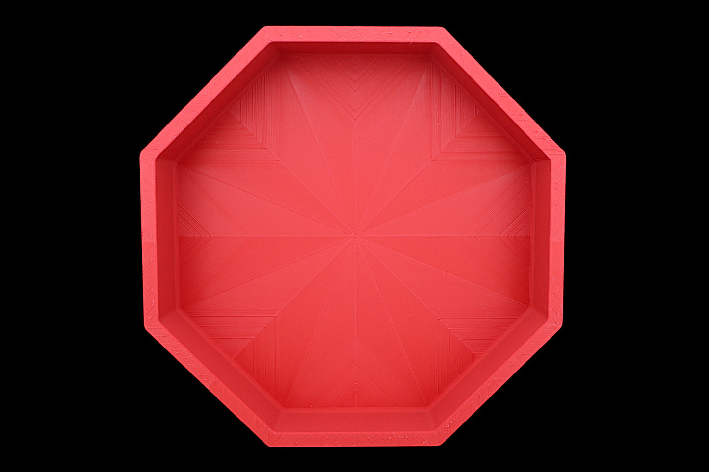 Catch-all tray – 3D printed in red PLA with octagonal shape and starburst base pattern, shown empty
