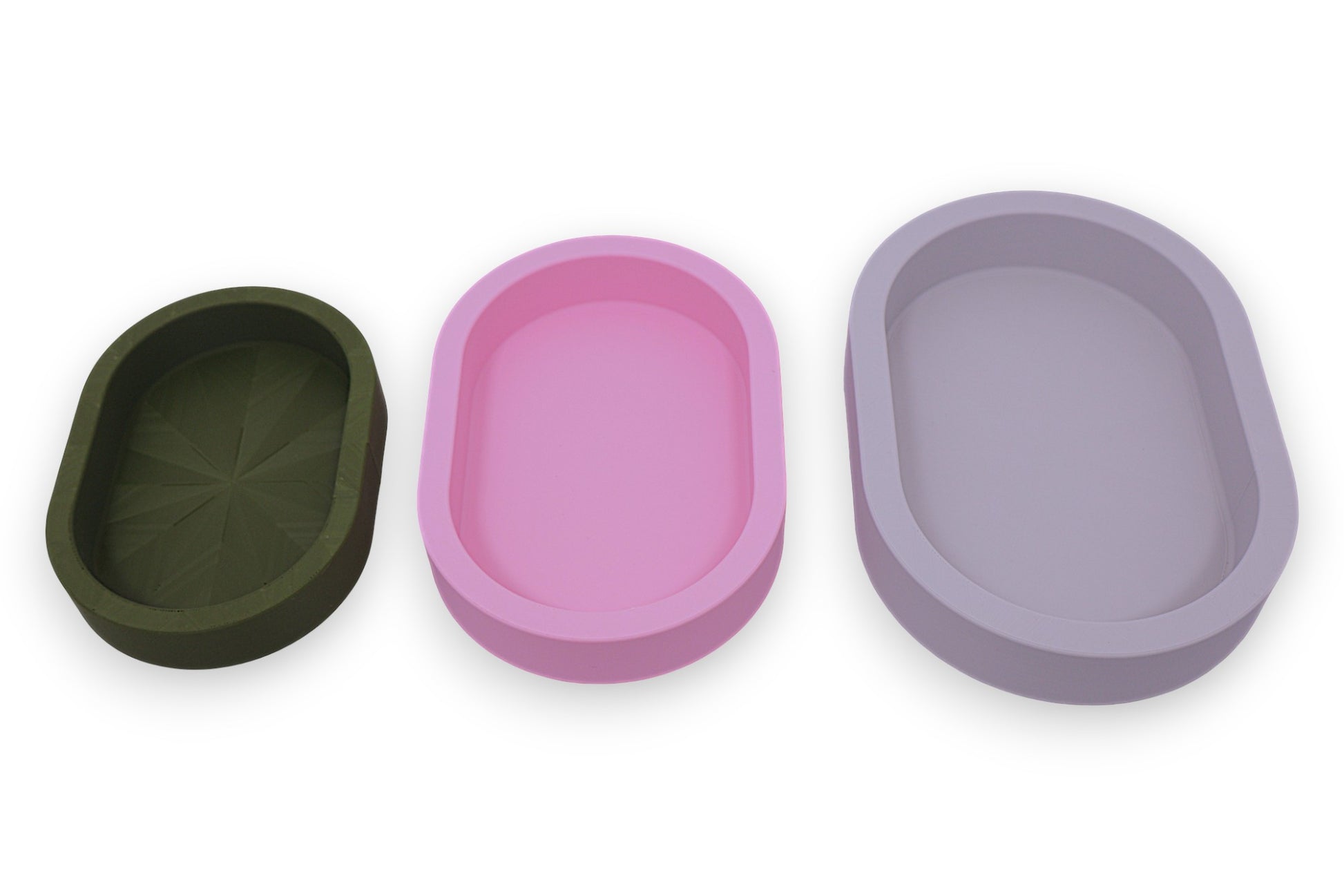 Catch-all trays – 3-pack set in green, pink, and white PLA, oval shape with smooth interiors, shown empty
