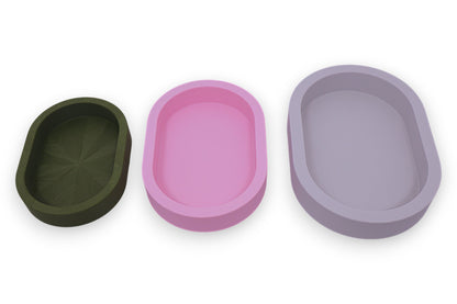 Catch-all trays – 3-pack set in green, pink, and white PLA, oval shape with smooth interiors, shown empty
