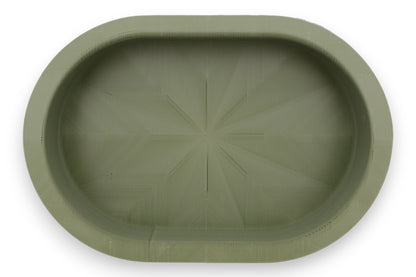 Catch-all tray – 3D printed in green PLA with oval shape and starburst base pattern, shown empty
