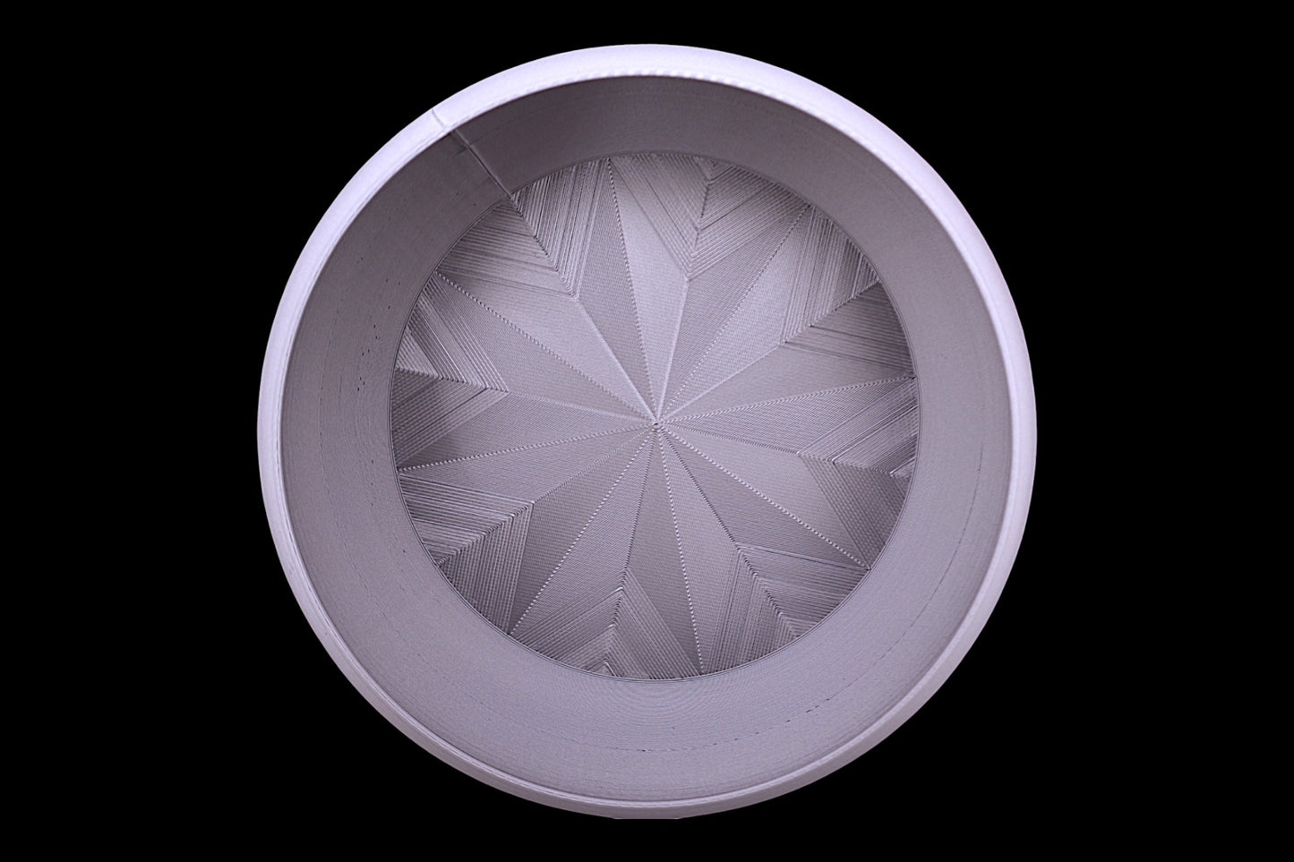 Catch-all tray – top-down view of gray PLA tray with geometric mesh base, starburst pattern
