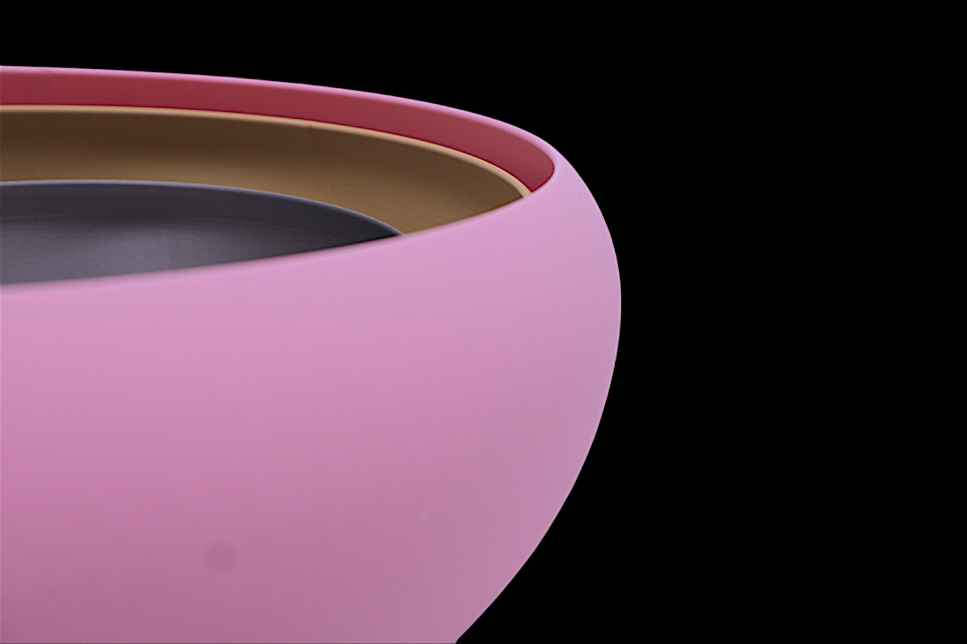 Catch-all tray – pink PLA outer ring with tan and dark gray inner layers, smooth curved surface
