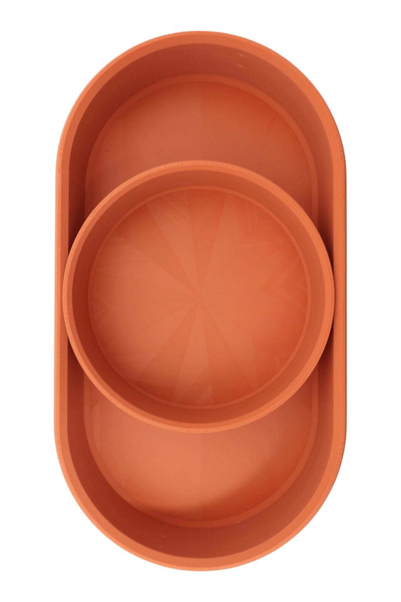 Catch-all tray – 3D printed in terracotta PLA with oval shape and starburst base pattern, shown empty
