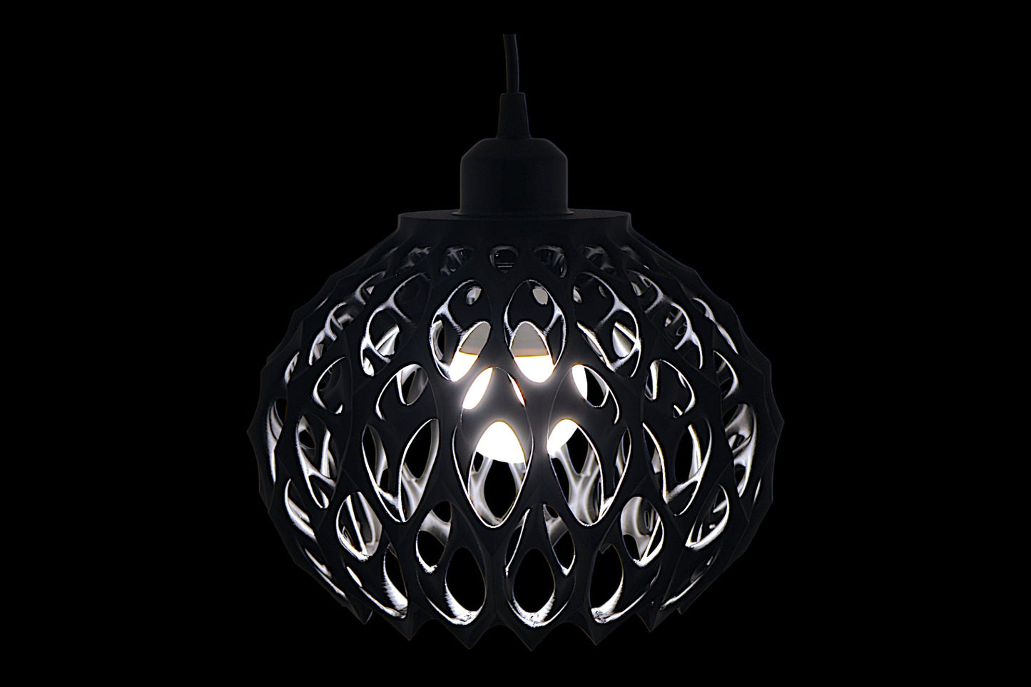Black spherical pendant light with cellular lattice shell and visible bulb