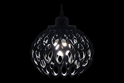 Black spherical pendant light with cellular lattice shell and visible bulb