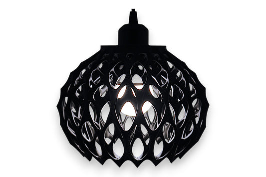 Black spherical pendant light with cellular lattice shell and visible bulb