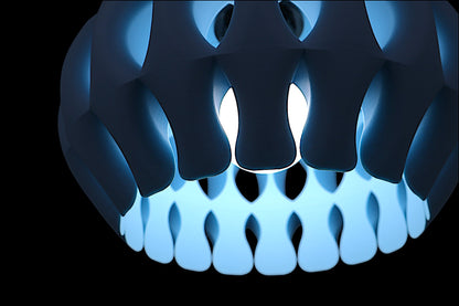 Pendant lamp – 3D printed in ice blue PLA with curved petal-like shell, glowing bulb visible through sculptural openings
