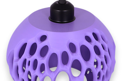 Purple textured lamp with black base on a white background