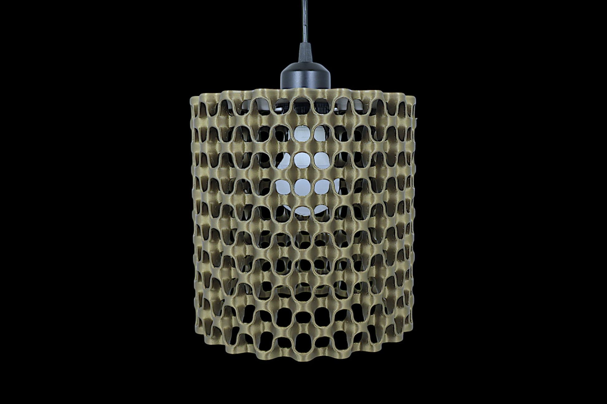 Pendant lamp – 3D printed with cylindrical shell featuring chain-like interlocking pattern and circular cutouts, suspended by black cord
