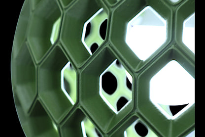 Close-up of a green honeycomb-like structure