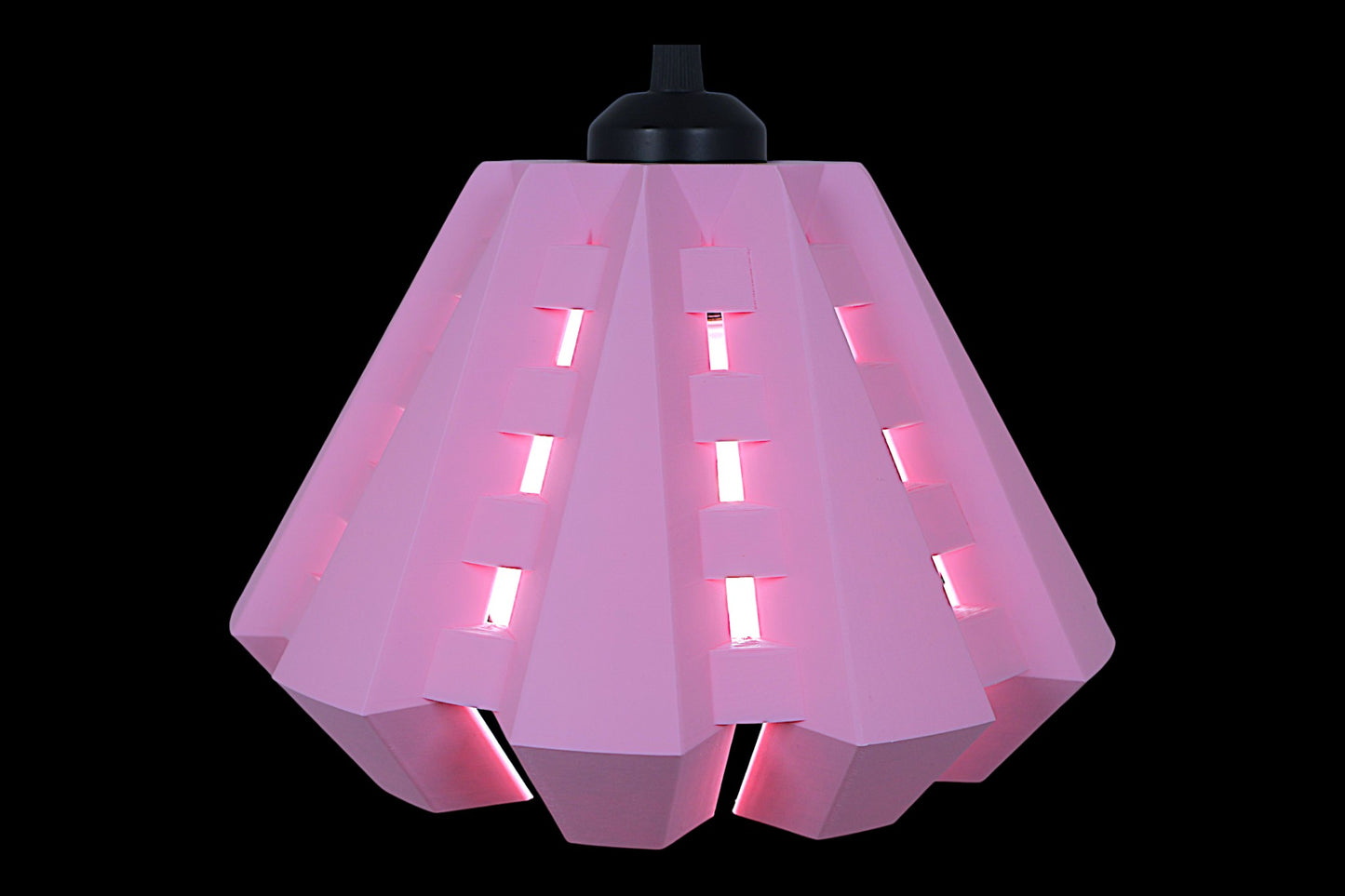Pendant lamp – 3D printed in pink PLA with angular shell and rectangular cutouts, glowing bulb visible inside
