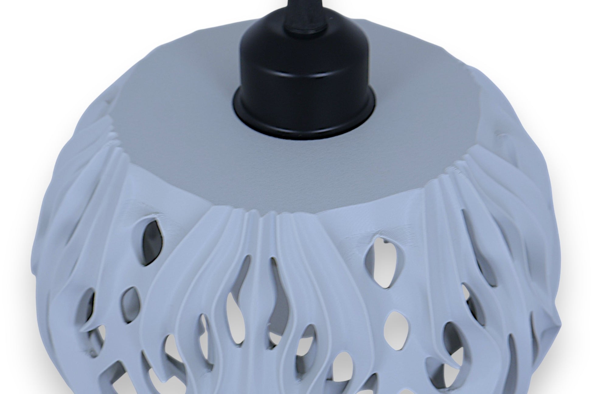 Pendant lamp – 3D printed with light gray shell and flame-inspired cutouts, glowing bulb visible through perforations
